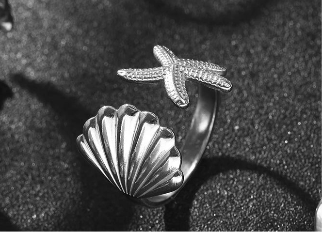 Shell starfish Stainless Steel Ring. This ring features a sleek shell and starfish design, offering a moderne and minimalist look. High quality material Engraved Pattern Ring Adjustable Wearing.